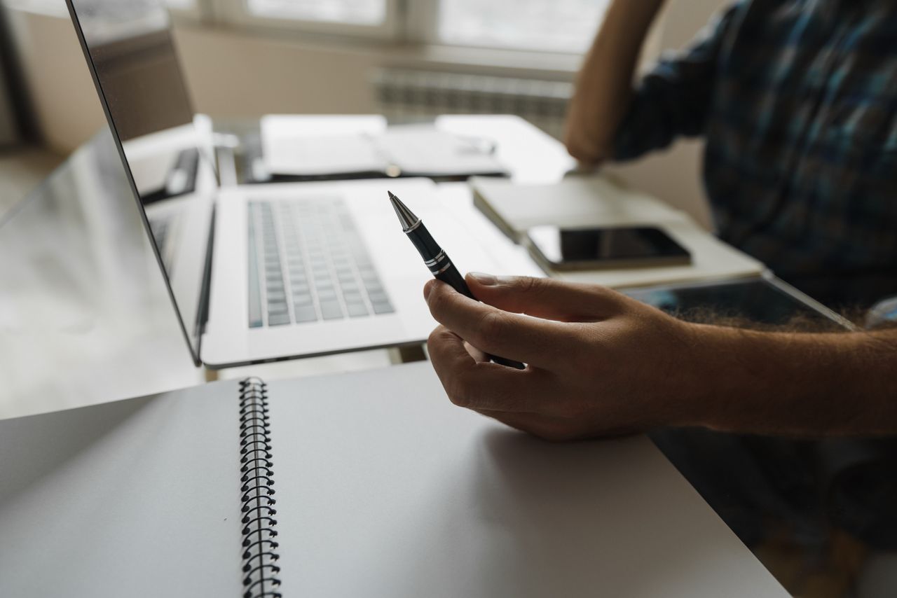 Business professional accessing company information through document management software